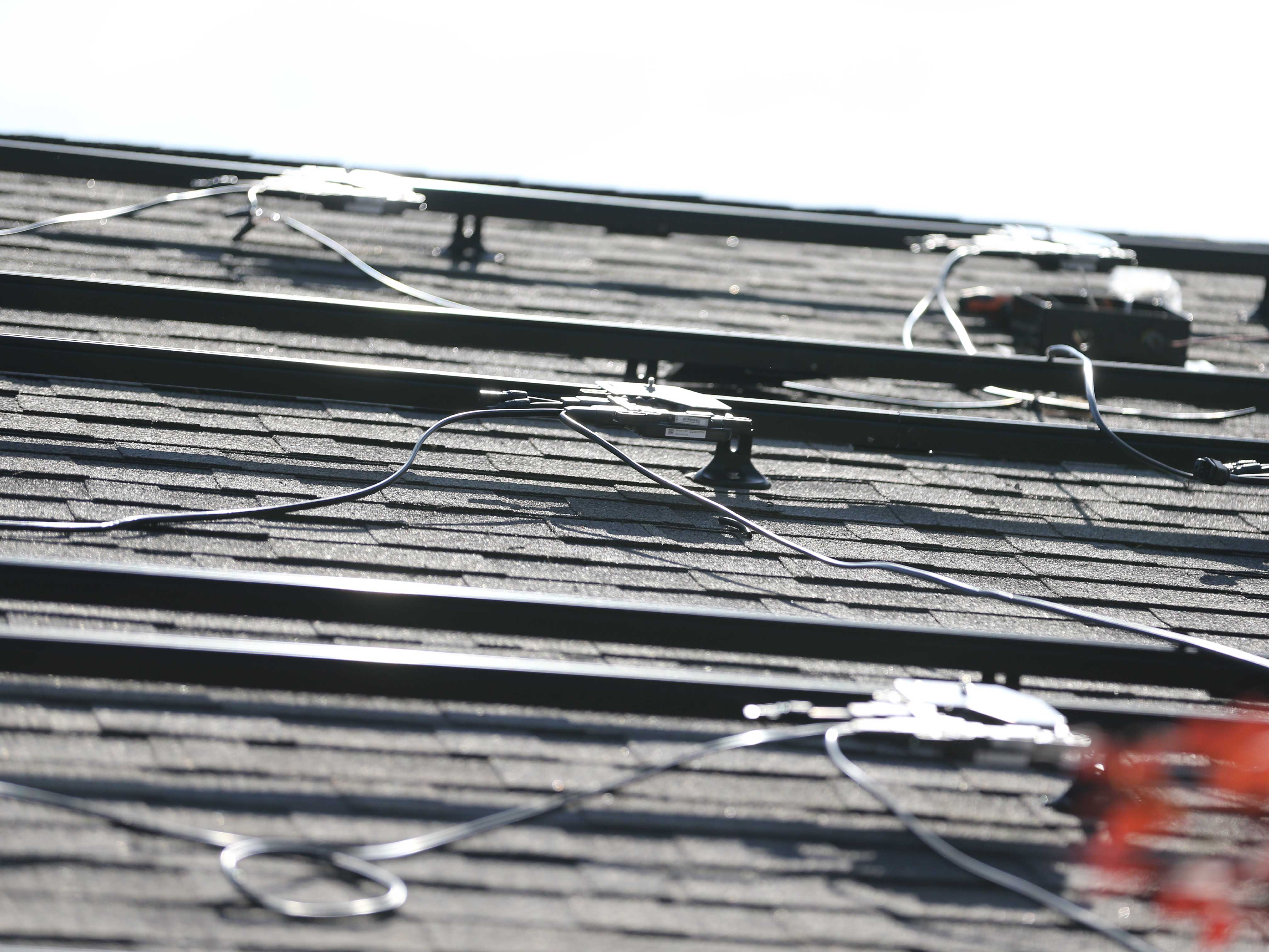 Portrait shot of roof in the process of solar installation